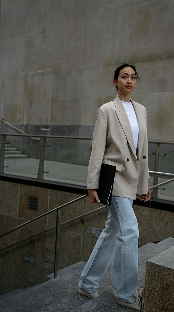 Young executive walking upstairs for internship.